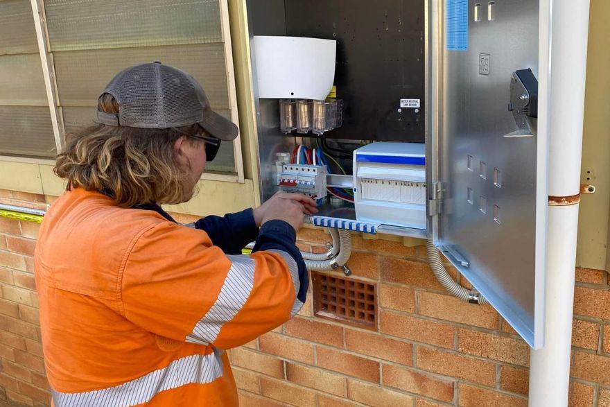 East Coast electrician working on a switchboard